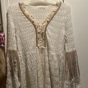 Beautiful crochet sweater! Suede fringe accents this beauty! Size medium.